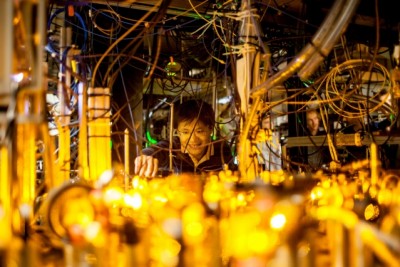 Graduate student Lawrence Cheuk adjusts the optics setup for laser cooling of sodium atoms.  Photo: Jose-Luis Olivares/MIT