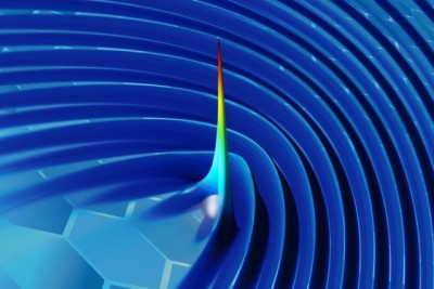 By using plasmons to “wiggle” a free electron in a sheet of graphene, researchers have developed a new method for generating X-rays. In this image of one of their simulations, the color and height represent the intensity of radiation (with blue the lowest intensity and red the highest), at a moment in time just after an electron (grey sphere) moving close to the surface generates a pulse. Courtesy of the researchers